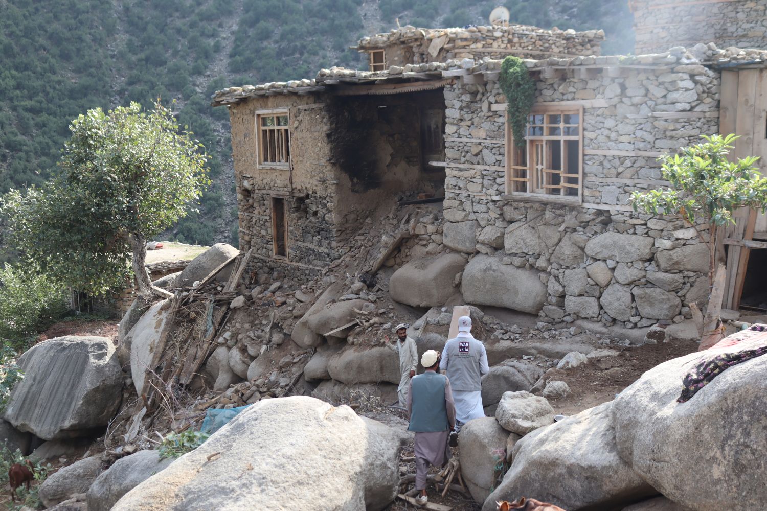 War Child staff assess earthquake damage and needs.